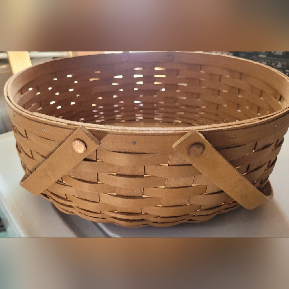 Longerberger lot of 2 baskets. The larger has awood divider and plastic insert.